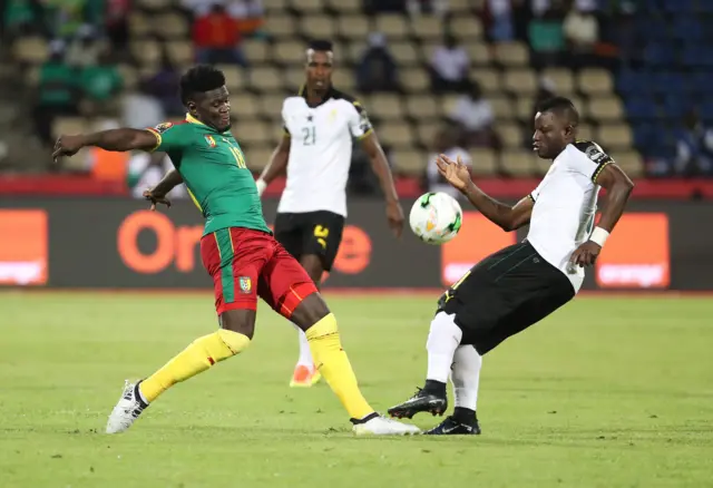 Robert Ndip Tambe of Cameroon challenged by Wakasu Mubarak of Ghana