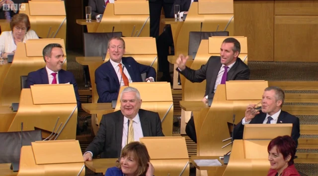 Liberal Democrat MSPs laugh at Nicola Sturgeon's barb at Willie Rennie