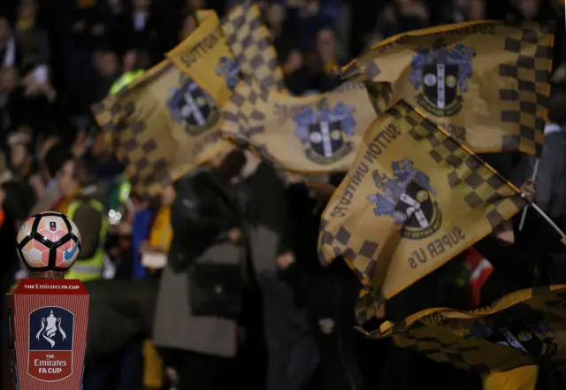 Sutton United fans wave flags