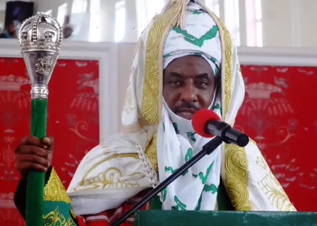 The emir of Kano Muhammadu Sanusi II speaks shortly after receiving staff of office during his coronation as the 57th emir of the ancient Kano emirate on February 7, 2015 at the newly built Coronation Hall near the Kano state governor's office.