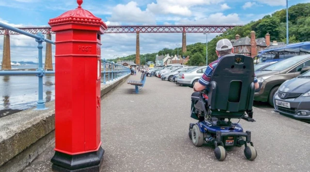 Wheelchair user in street