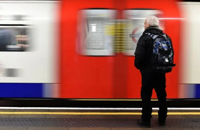 Tube train passes through station