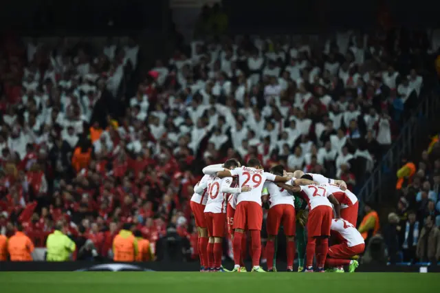 Monaco players huddle