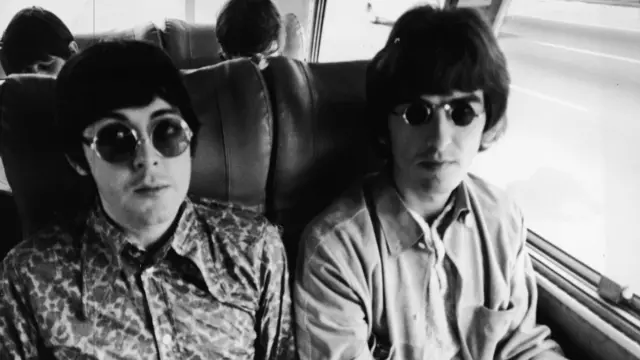 George Harrison (right) and Paul McCartney of The Beatles