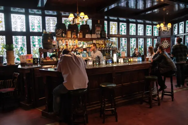 Customers in a pub