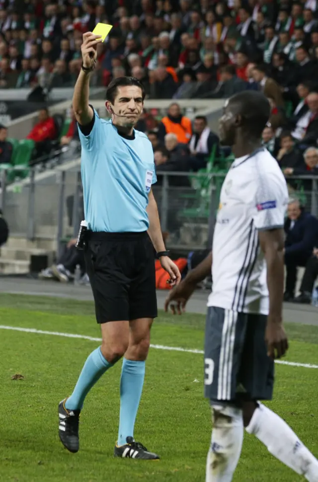 Eric Bailly is shown a yellow card