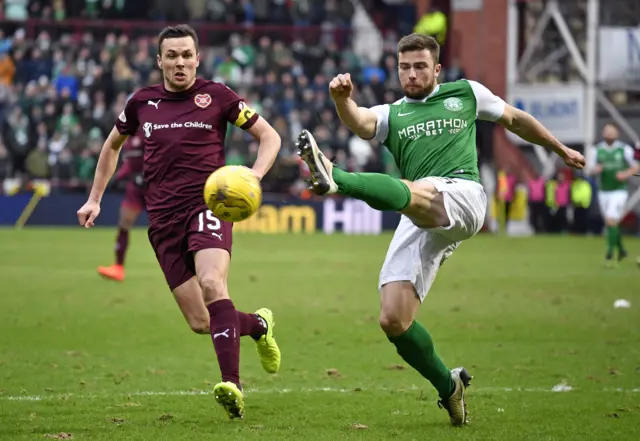 Hearts midfielder Don Cowie (left) in action against Hibs