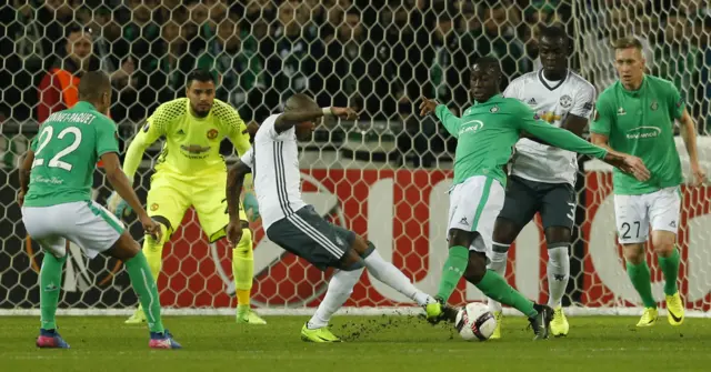 Ashley Young scrambles Romain Hamouma's ball away