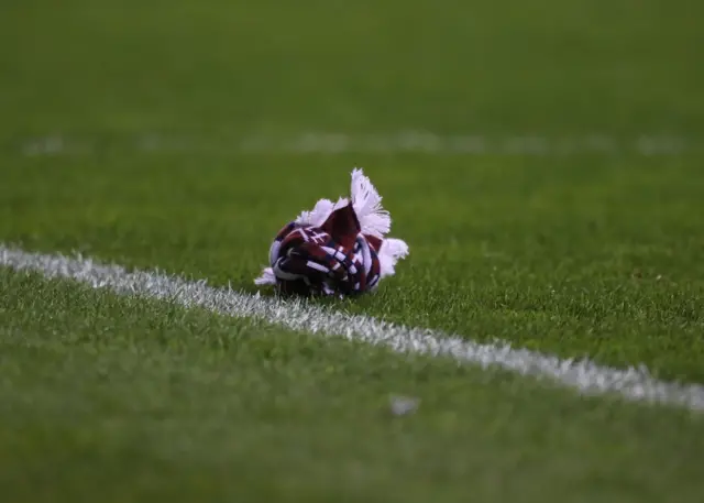 A Hearts scarf thrown from the stand