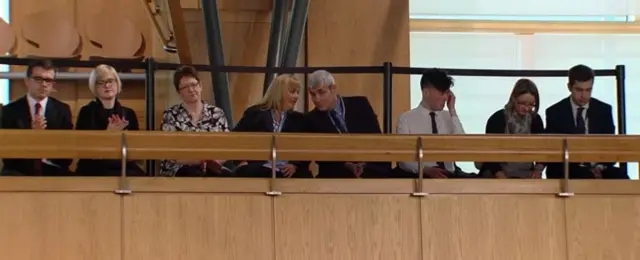 Gordon's family and friends are in the gallery listening to the debate