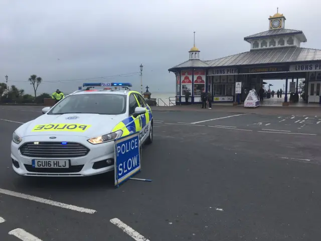 Police car outside Eastbourne pier