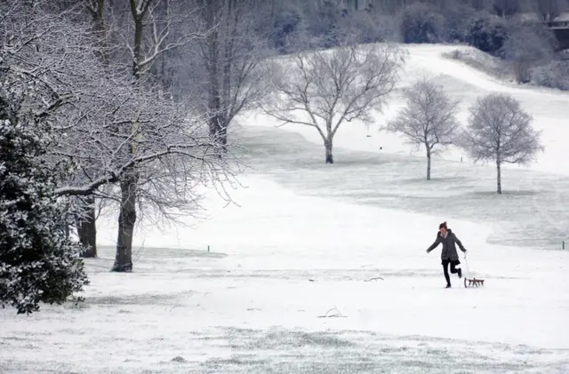 Girl running in the snow