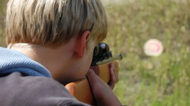 Young man with air gun