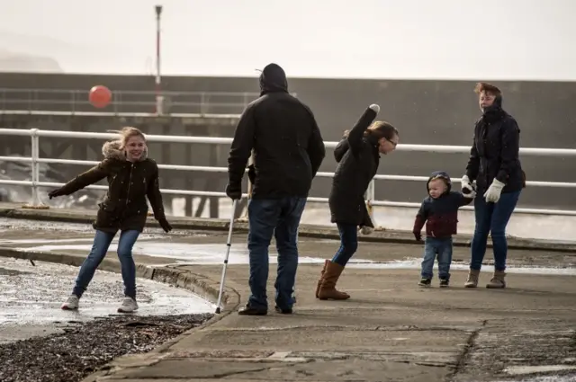 Walkers at the sea front in Aberystwyth...