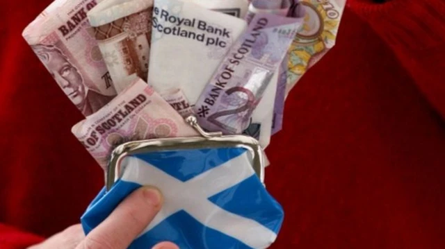 Saltire purse containing money