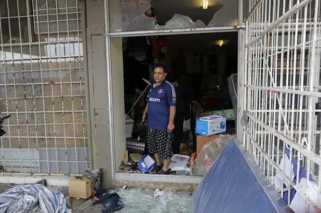 Pakistani man in looted shop