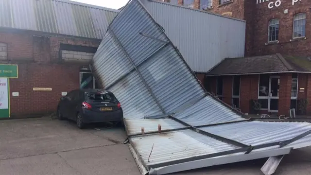 
          This car was struck by part of the corrugated roof of a warehouse on New Road in Kidderminster.
        