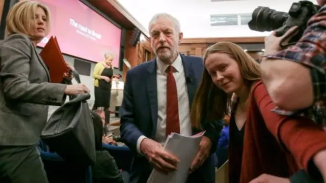 
          Jeremy Corbyn leaving the podium after delivering a speech in London
        