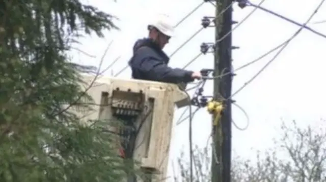 Man repairing power line