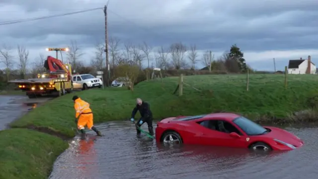 Red Ferrai being recovered