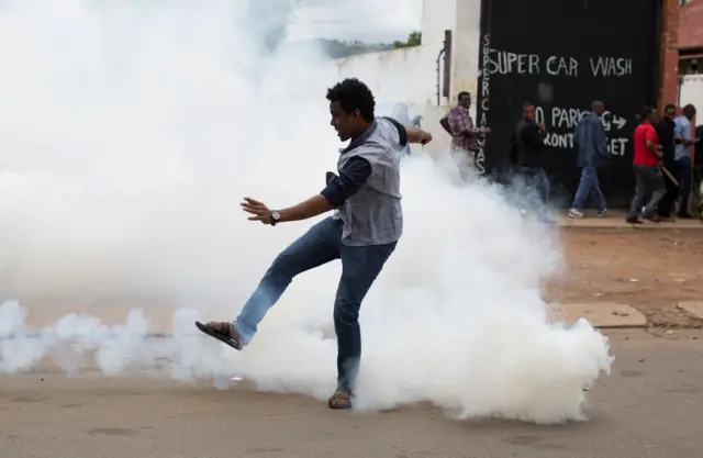 man reacts to teargas