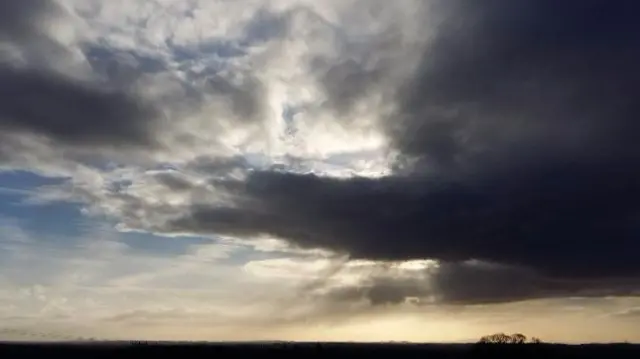 Sun breaking through cloud