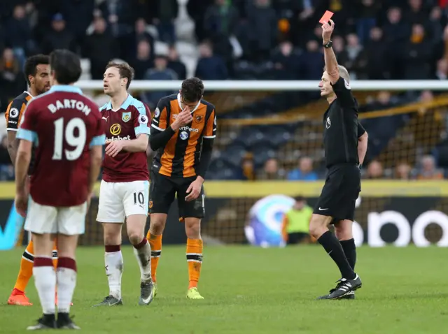 Ashley Barnes is shown a red card