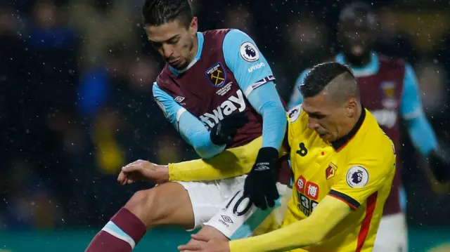 Manuel Lanzini in action with Watford"s Jose Holebas