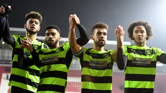 Huddersfield players celebrate their win at Rotherham