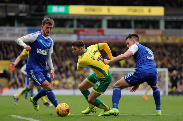 Wes Hoolahan and Jonas Knudsen (right) in action