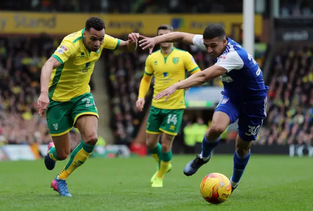 
          City's Jacob Murphy and Town's Myles Kenlock battle for the battle
        