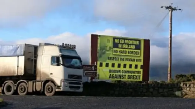 
          A  truck passes a Brexit billboard in Co. Armagh, on the northern side of the border between Northern Ireland and the Republic of Ireland,
        