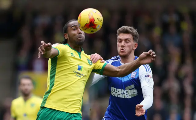 Cameron Jerome and Emyr Huws in action