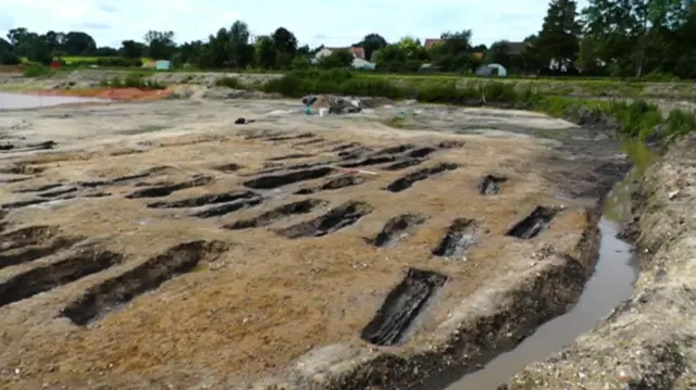 Some of the uncovered coffins in the land