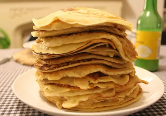 Stack of pancakes on a white plate