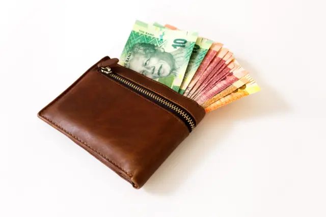 A wallet with South African rand