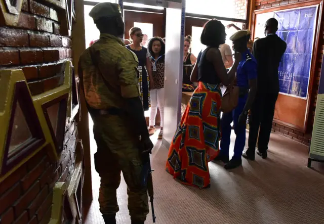 
          Burkinabe policemen check festival goers prior to a Fespaco screening
        