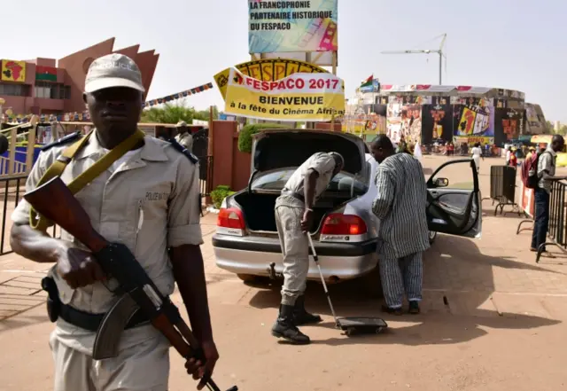 
          Police officers check cars at the entrance to the Pan-African Film and Television Festival (Fespaco) in Ouagadougou on February 27, 201
        