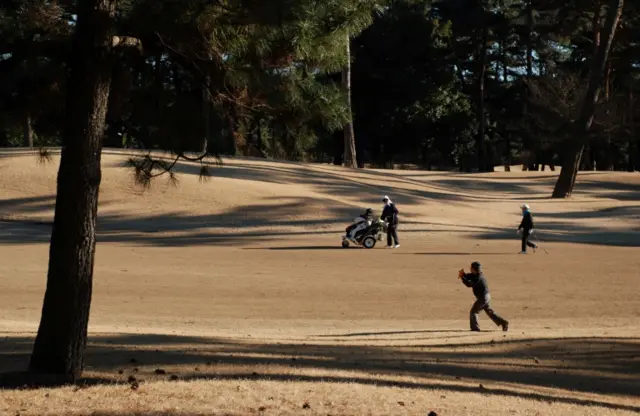 Golfers at Kasumigaseki Country Club in Kawagoe, Saitama