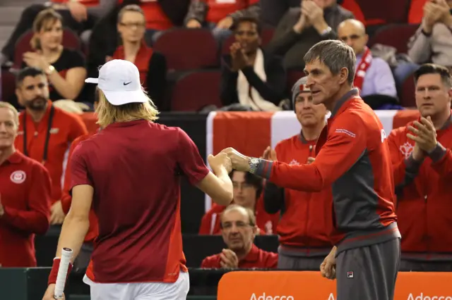 Denis Shapovalov fist pumps his coach