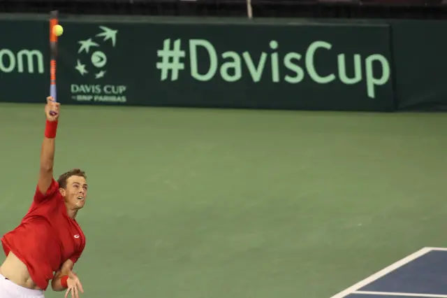 Vasek Pospisil serves