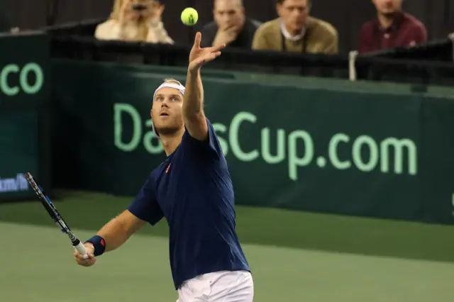 Dominic Inglot of Great Britain serves