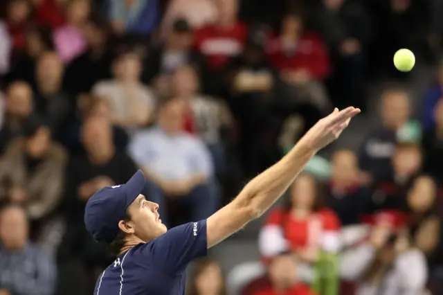 Jamie Murray of Great Britain serves