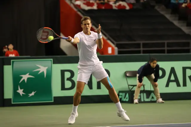 Vasek Pospisil of Canada returns