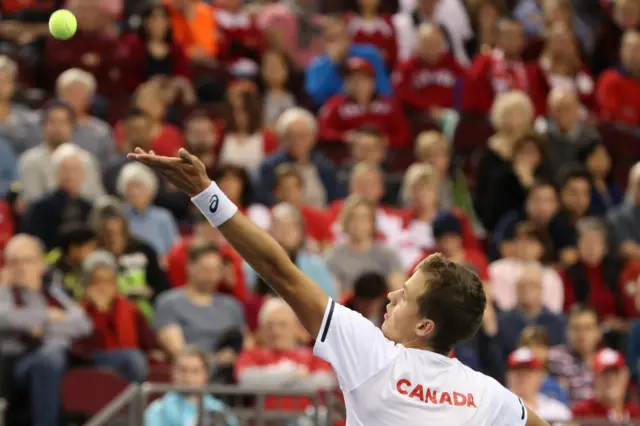 Vasek Pospisil serves