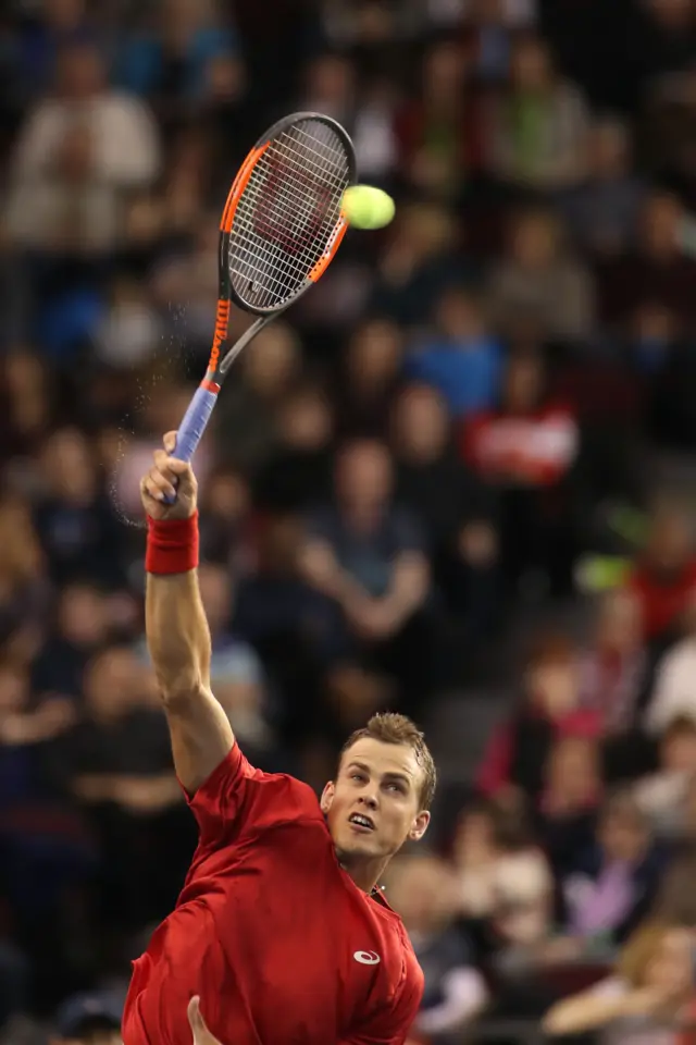 Vasek Pospisil serves