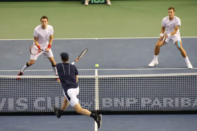 Jamie Murray of Great Britain volleys