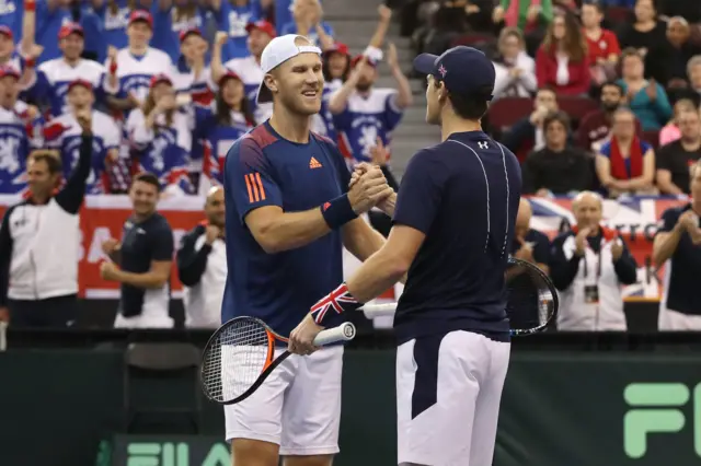 Jamie Murray and Dominic Inglot of Great Britain congratulate each other