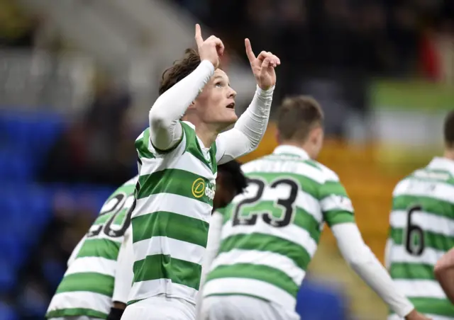 Liam Henderson celebrates