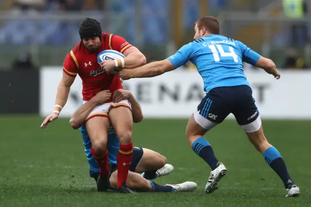 Leigh Halfpenny of Wales is tackled by Giulio Bisegni of Italy